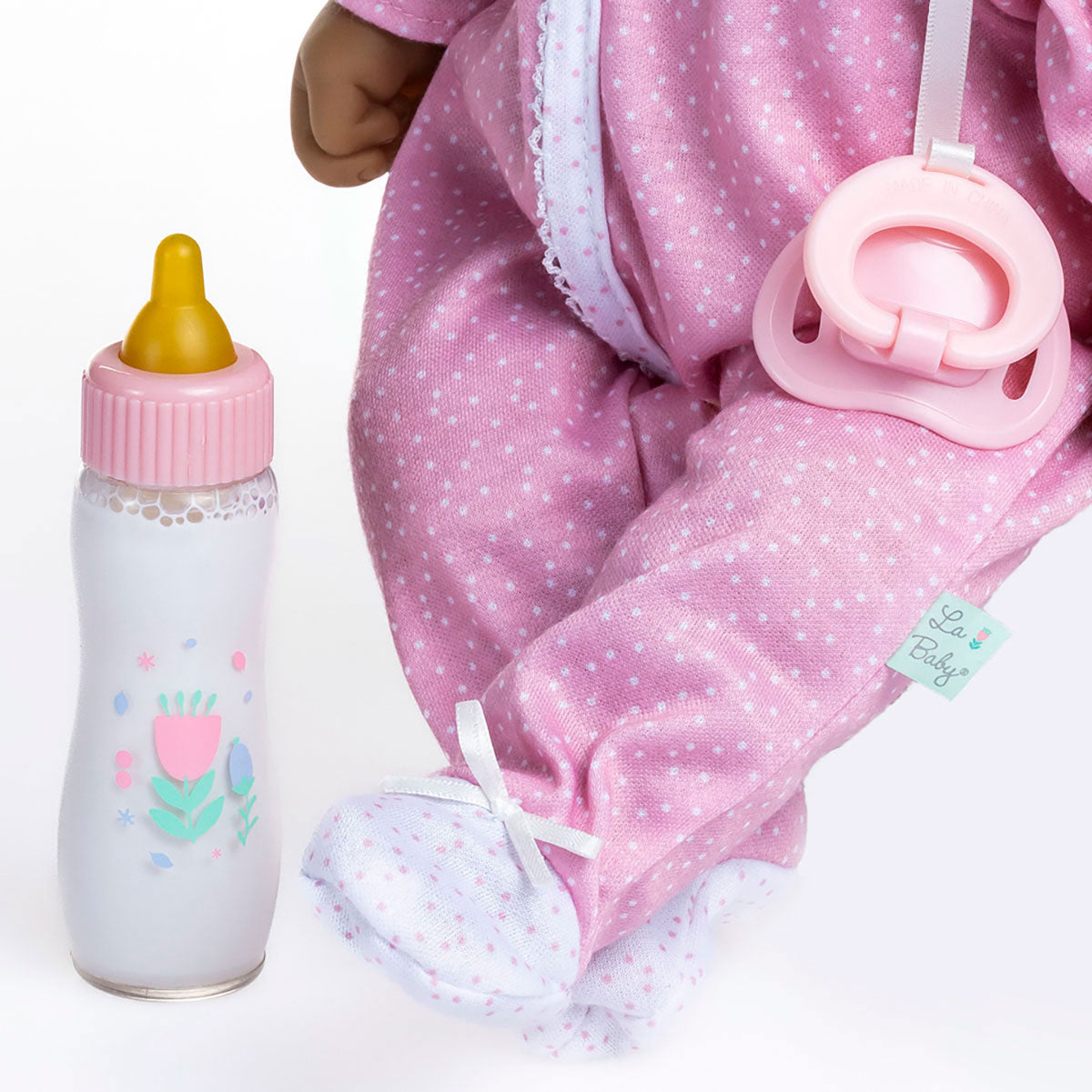 La Baby ® 16" Soft Body Baby Doll Pink/White Onesie w/ Pacifier & Magic Bottle. Hispanic.