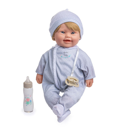 A 16 inches soft body baby doll with blonde hair, wearing a grey sleeper and sitting next to a baby bottle.