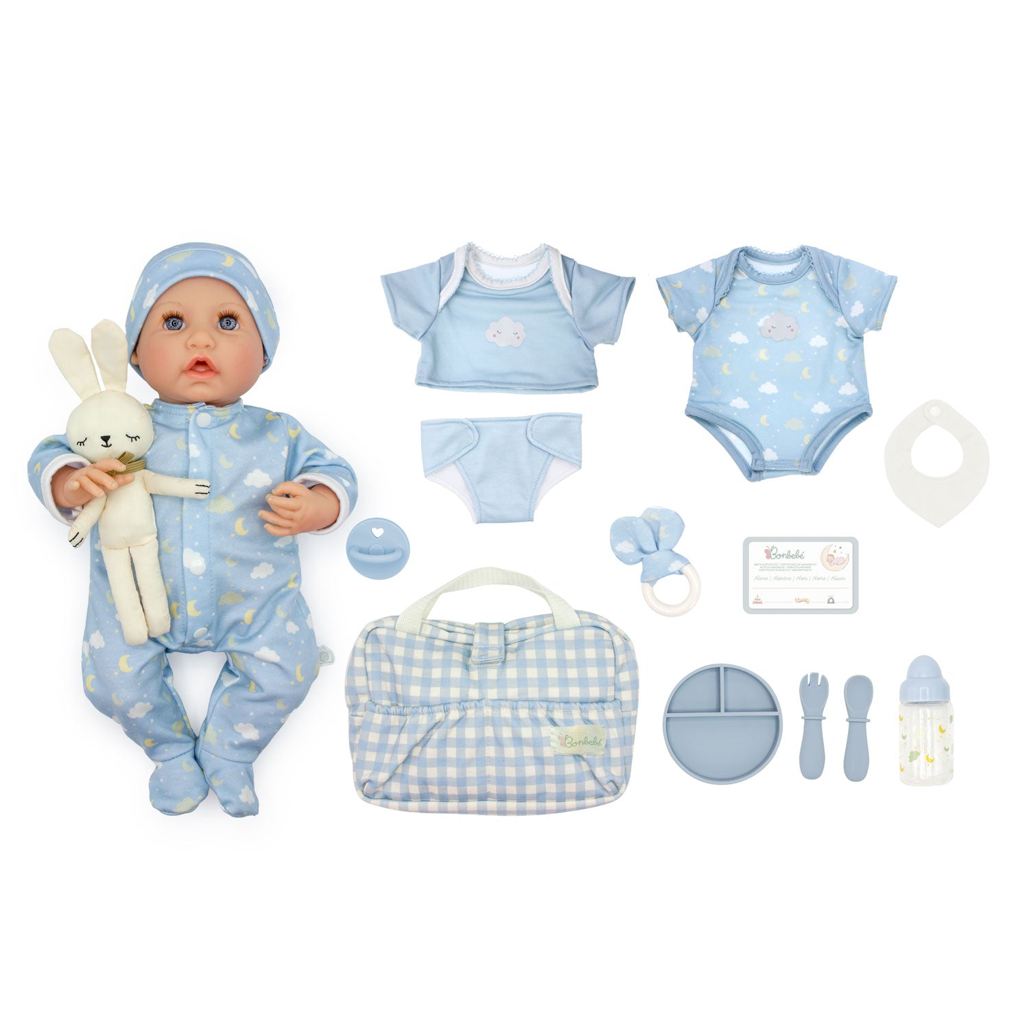 A baby doll playset with a blue cloud-printed footed sleeper and matching hat, a plush bunny, and multiple matching accessories including a short-sleeve top, bodysuit, bib, pacifier, diaper bag, plate, spoon, and bottle, all arranged on a white background.