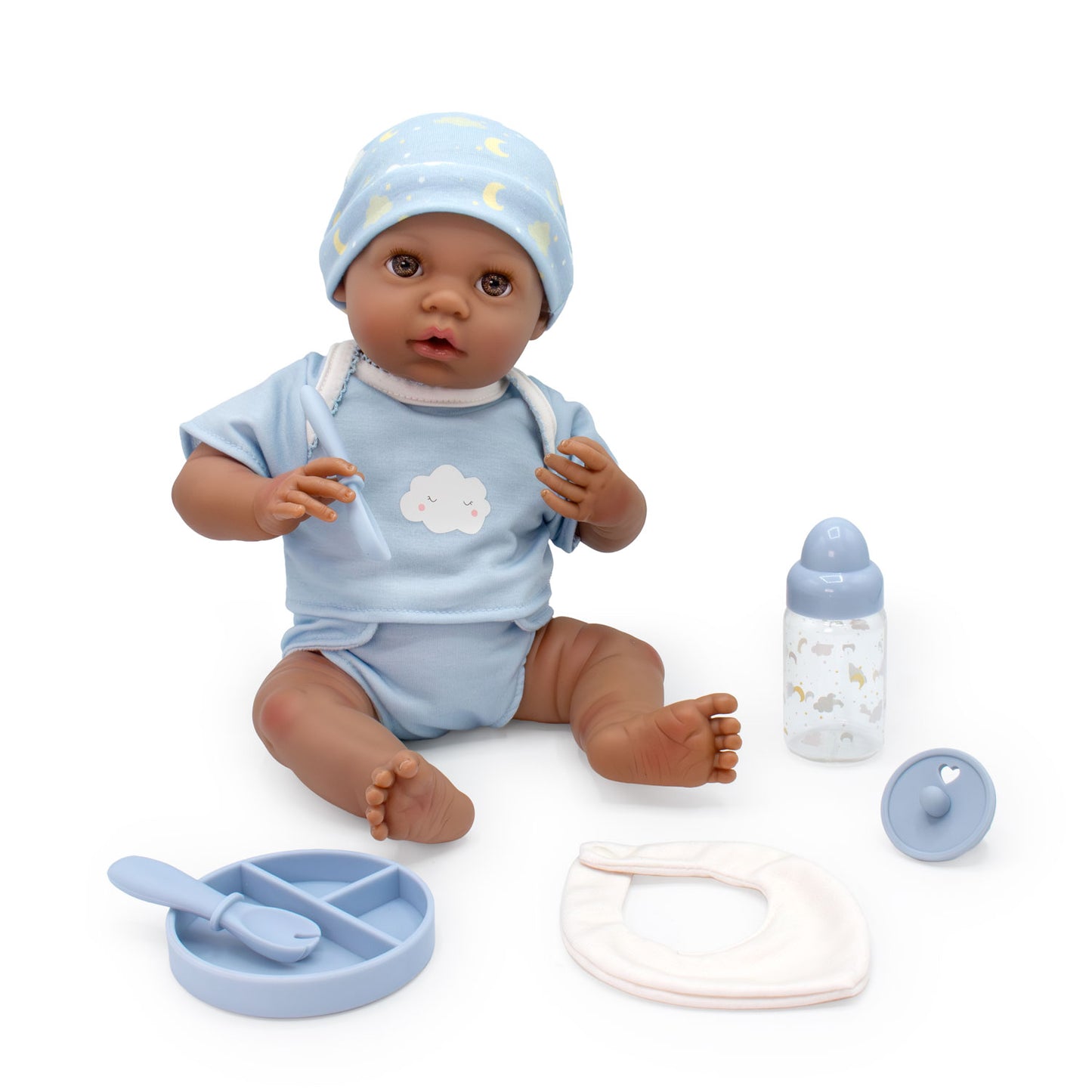 Baby doll with accessories on a white background