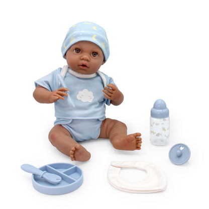 Baby doll with accessories on a white background