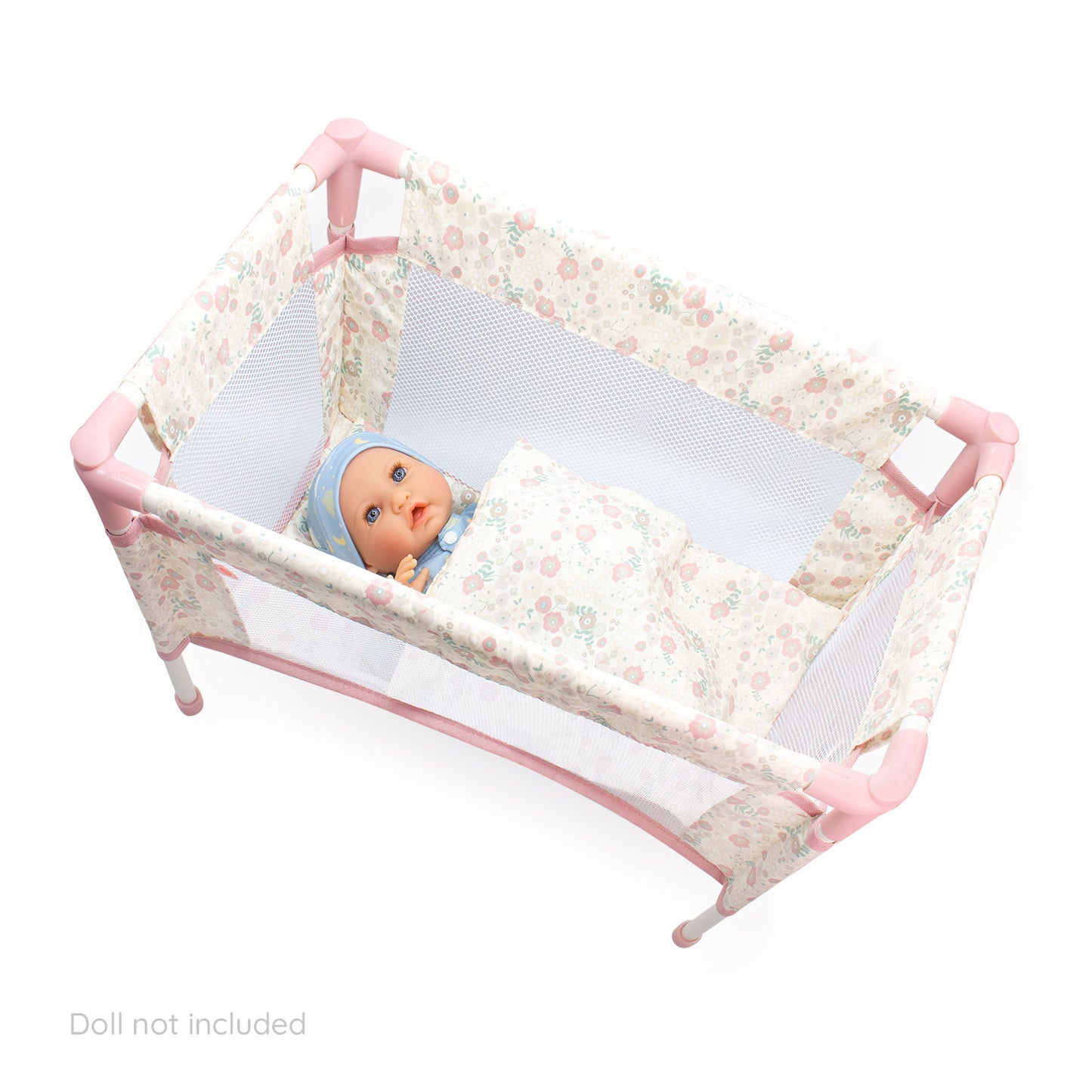 Floral crib with a baby doll inside on a white background