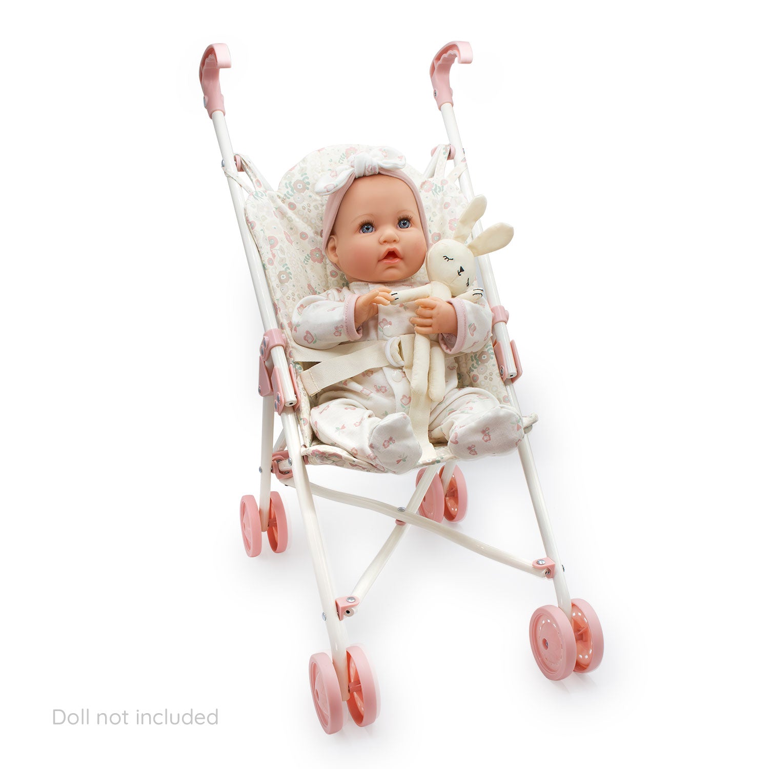 Baby doll in a pink stroller with a white background