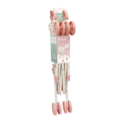 Set of pink and white measuring cups and spoons with a packaging label on a white background