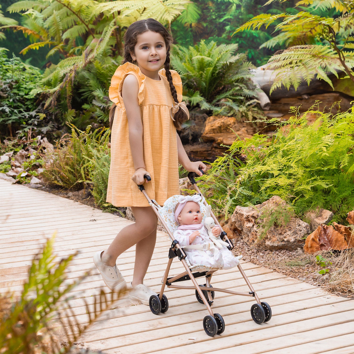Child pushing stroller