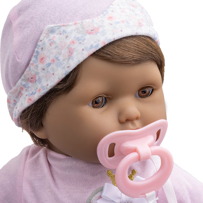 doll with pacifier and brown hair
