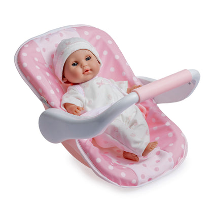 12.5" Nonis baby doll in a pink polka dot carrier with a white outfit and hat.