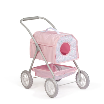 Pink pet stroller with a cushioned top in a child's room with toys and decor.