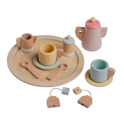 A wooden tea party set for dolls, including a crib, tray, spoons, tea bags, pot, plates, cups, sugar jar, and a milk pitcher, all in eco-friendly sustainable wood.