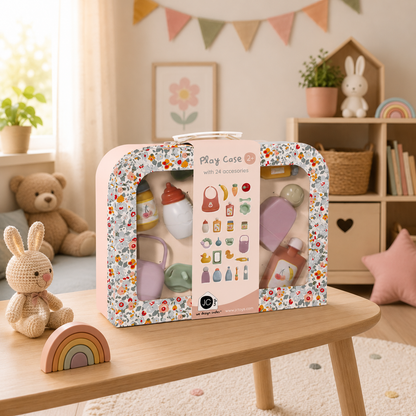 Children's play case with toys on a wooden table in a room with decor elements.