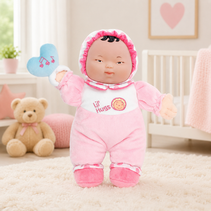 Stuffed toy in pink outfit with 'Lil Hugs' branding in a nursery setting.