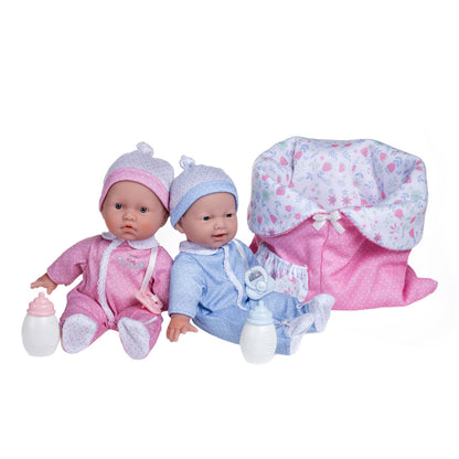 Two 11-inch JC Toys La Baby dolls in pink and blue outfits with a reversible sleeping bag, designed for young children.